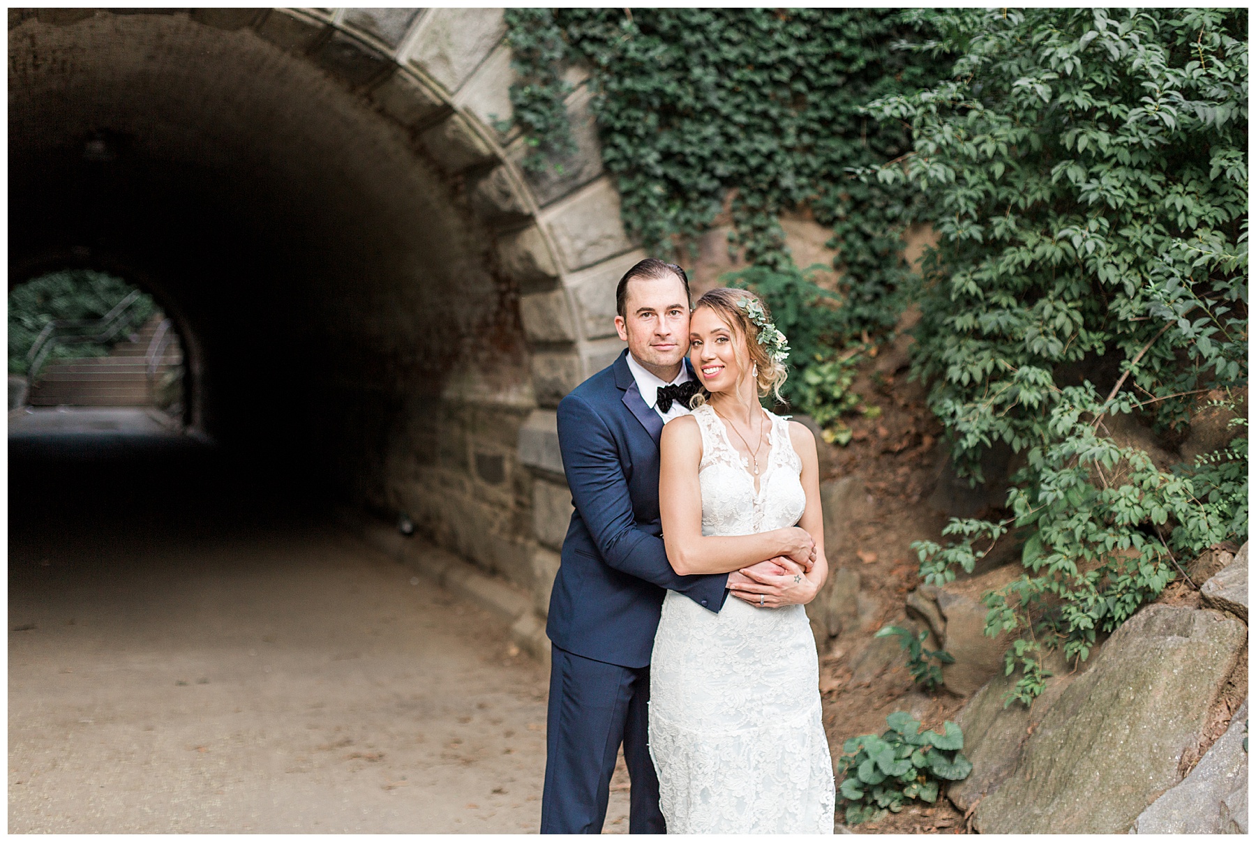 bride and groom in front of a tunnel in central park wedding 