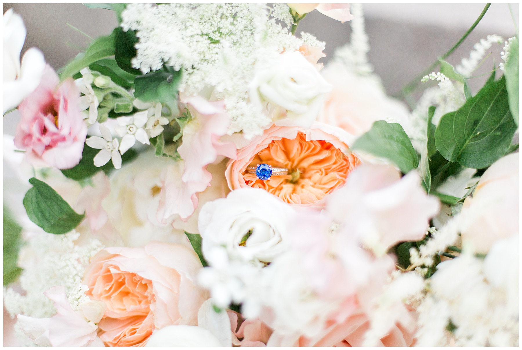 blue wedding ring inside bridal bouquet 