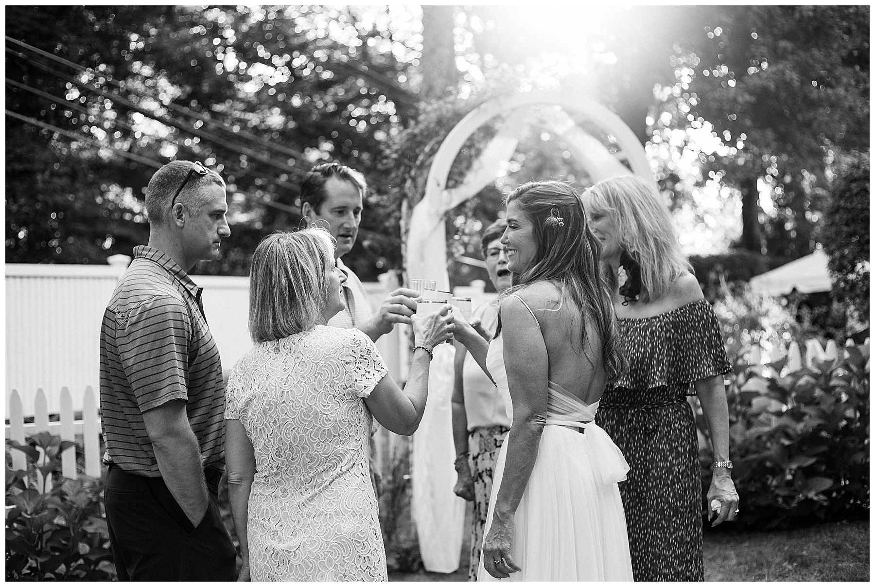 family cheers during backyard wedding in new canaan Connecticut 
