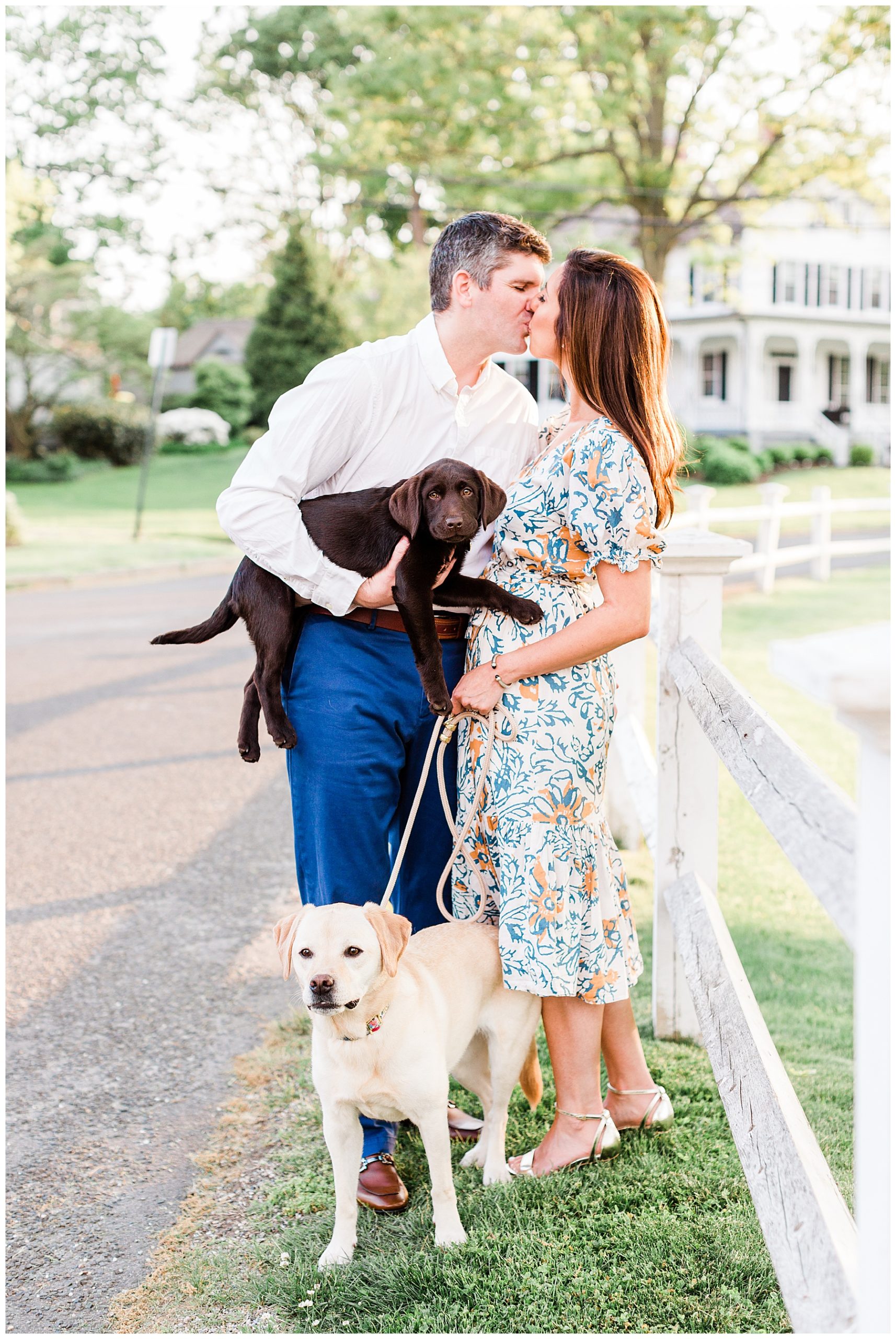 Bride-and-groom-engagement-session-kissing-with-dogs