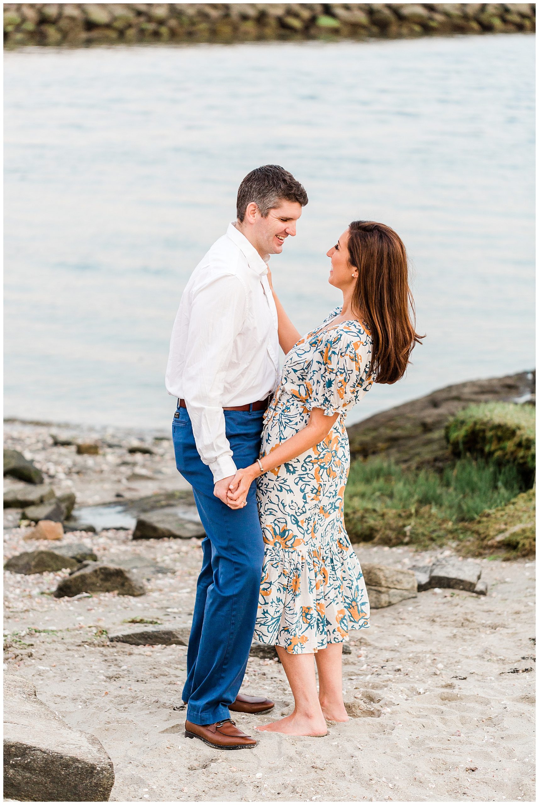 Bride-and-groom-standing-on-beach-long-island-sound