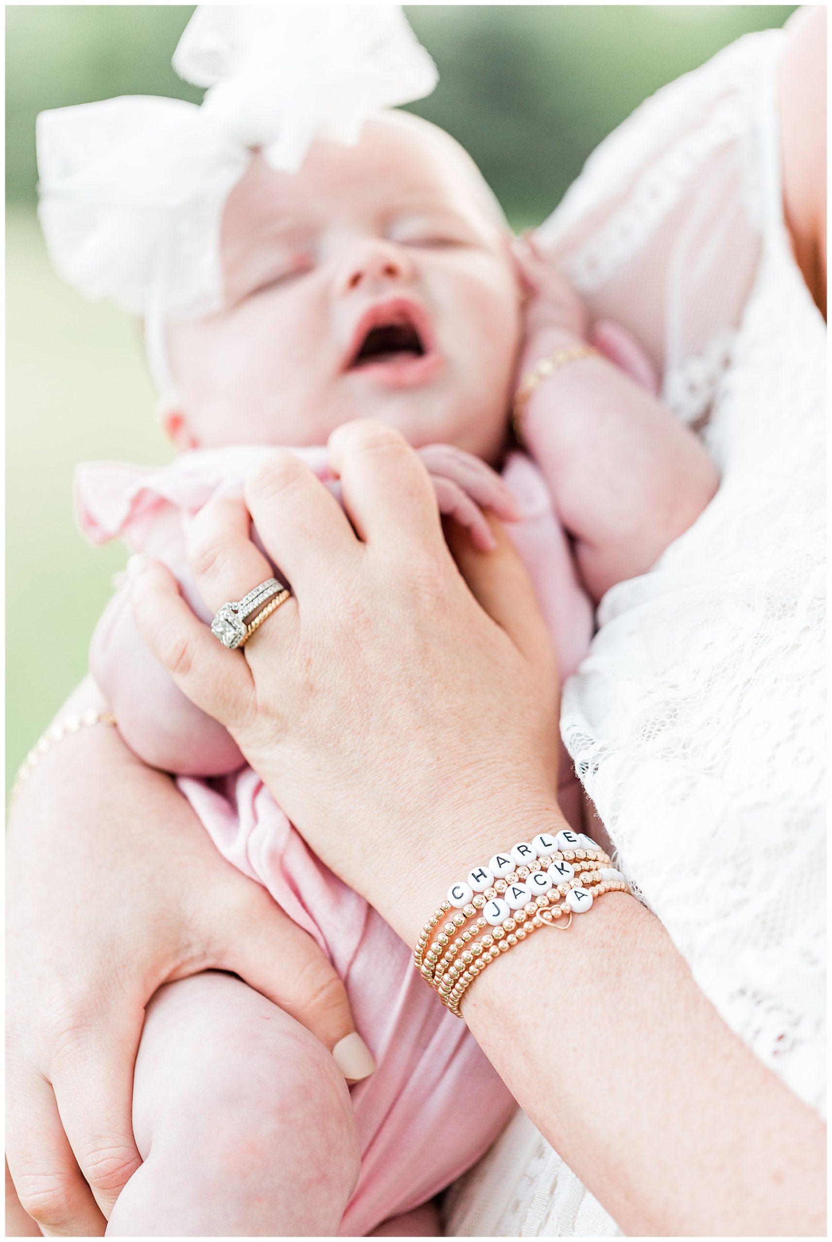 Mom-holding-newborn-baby-lifestyle-family-session