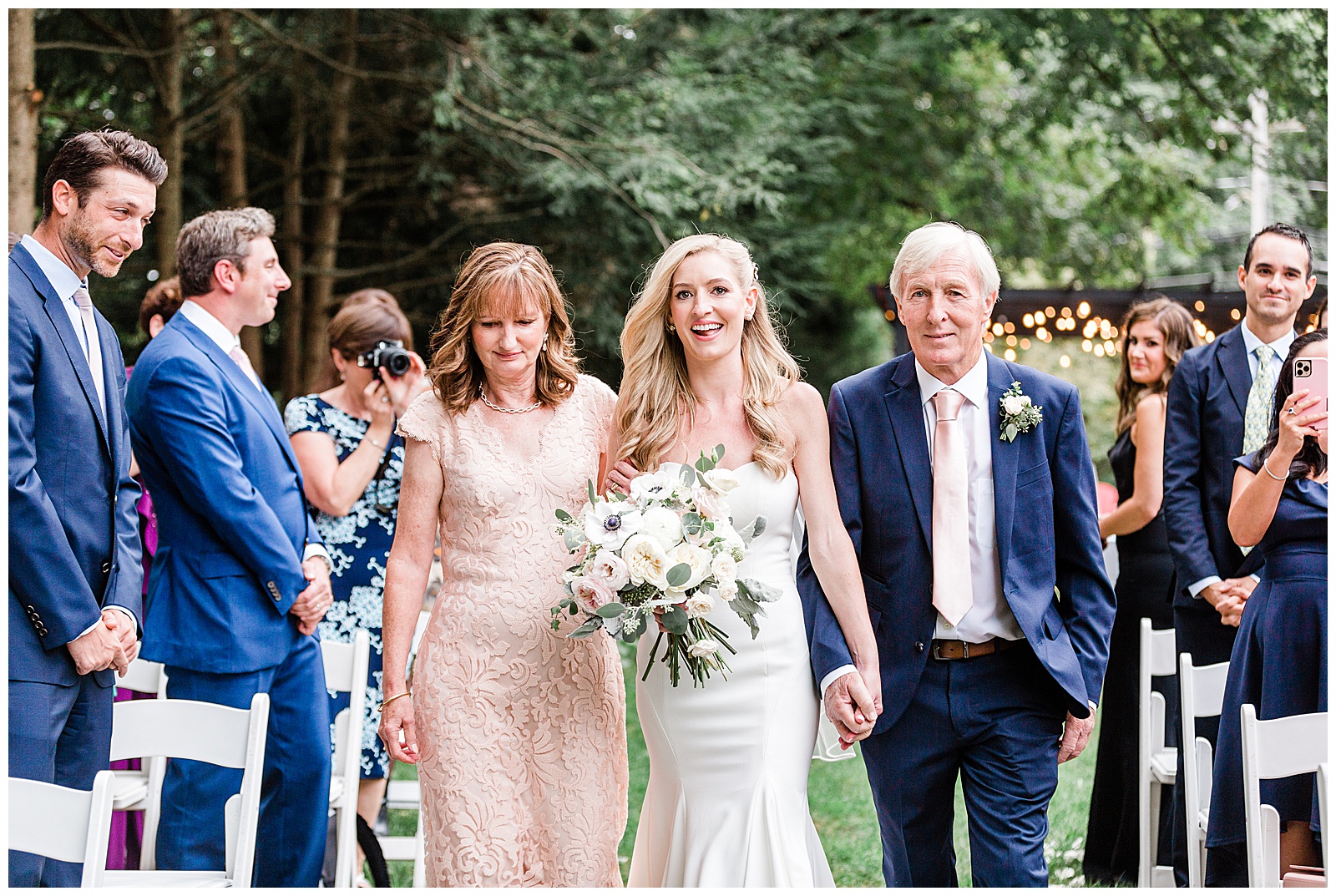 bride-walking-down-the-aisle-with-parents.jpg