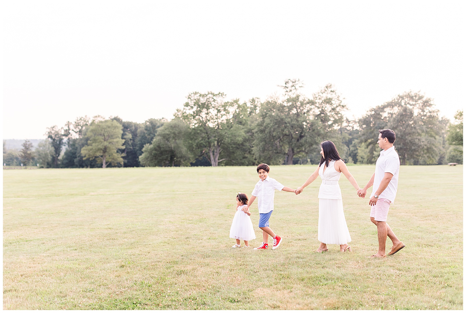 family-walking-in-a-field-new-canaan-connecticut.jpg